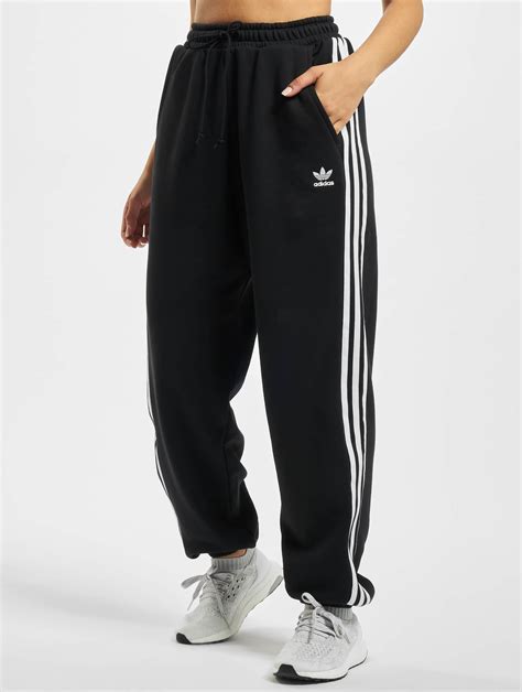 adidas jogginghose außen schwarz innen orange